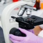 Clinical Pathologist with Microscope